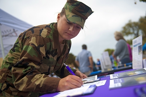 Service member at outreach event
